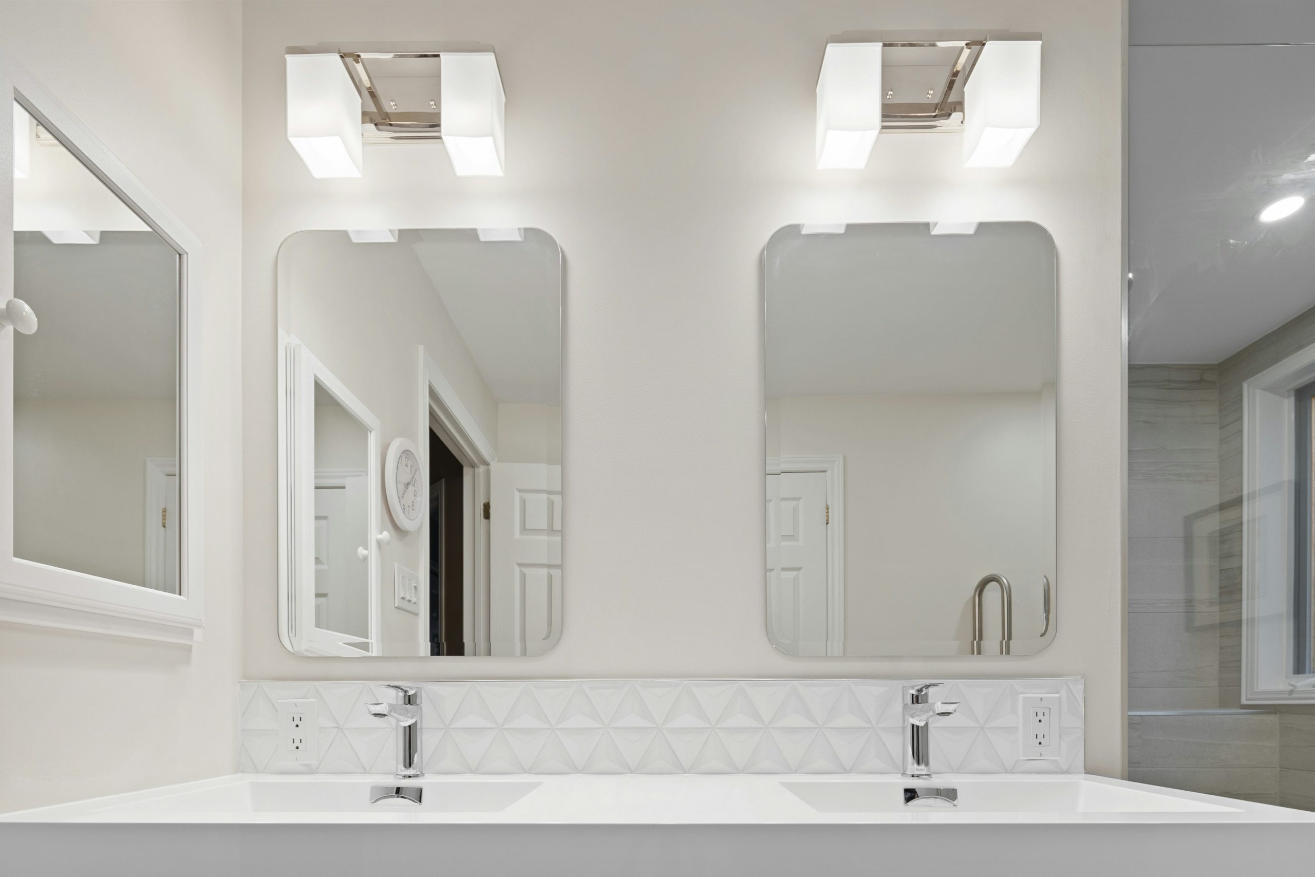 Modern bathroom interior with double sink vanity and illuminated mirror, clean and professional finish