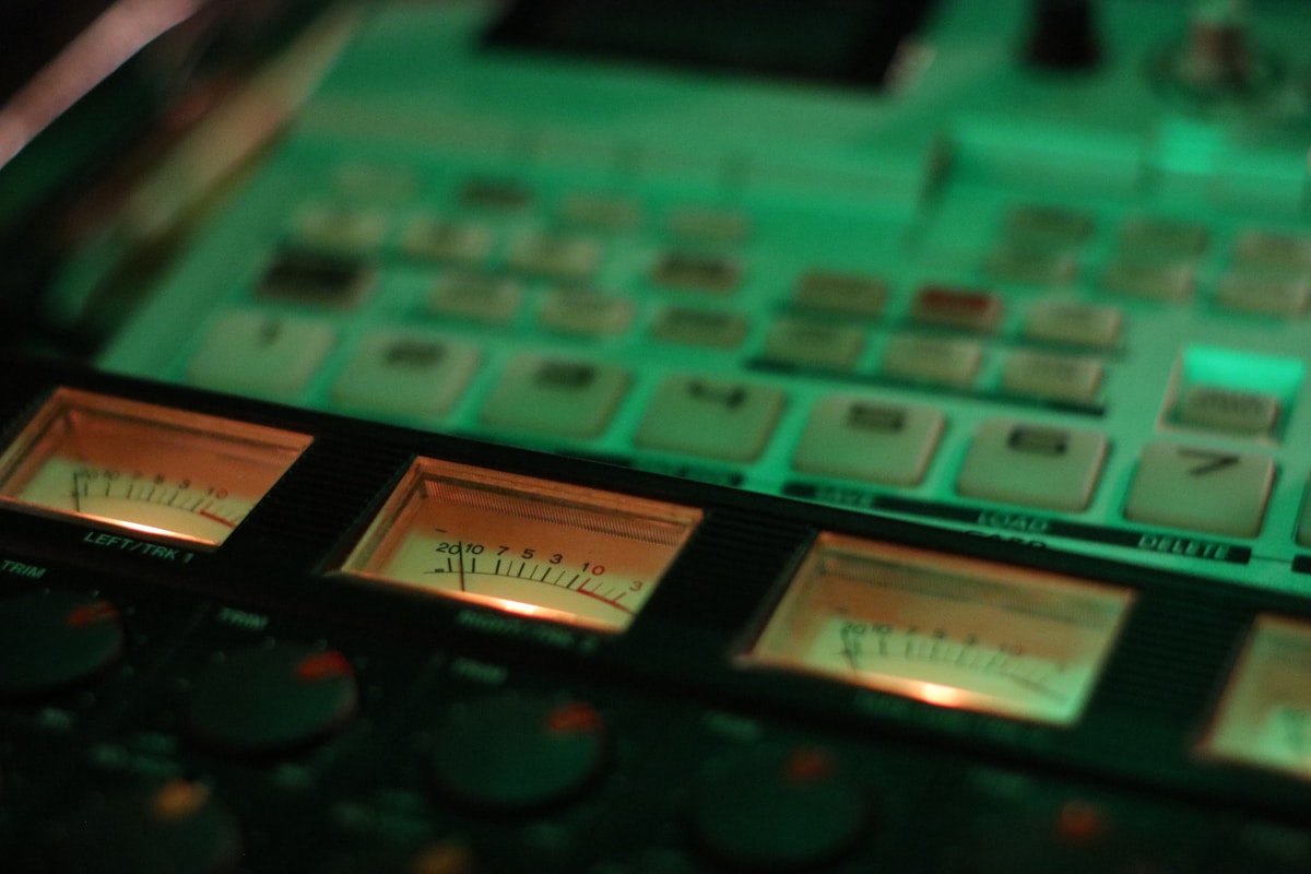 Close-up of audio equipment with glowing meters