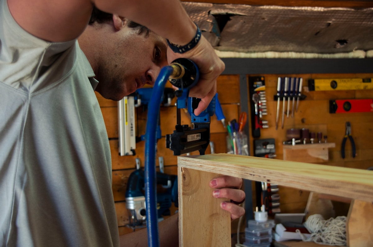 a man working on a piece of wood